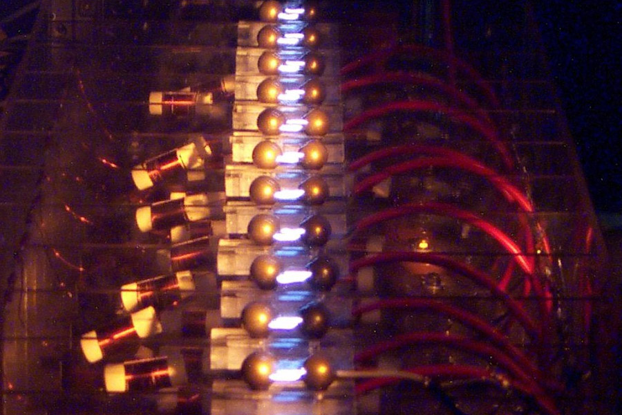 The spark-gaps of a Marx generators firing.